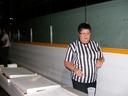 Kim showing off our referee shirts & serving up pizza